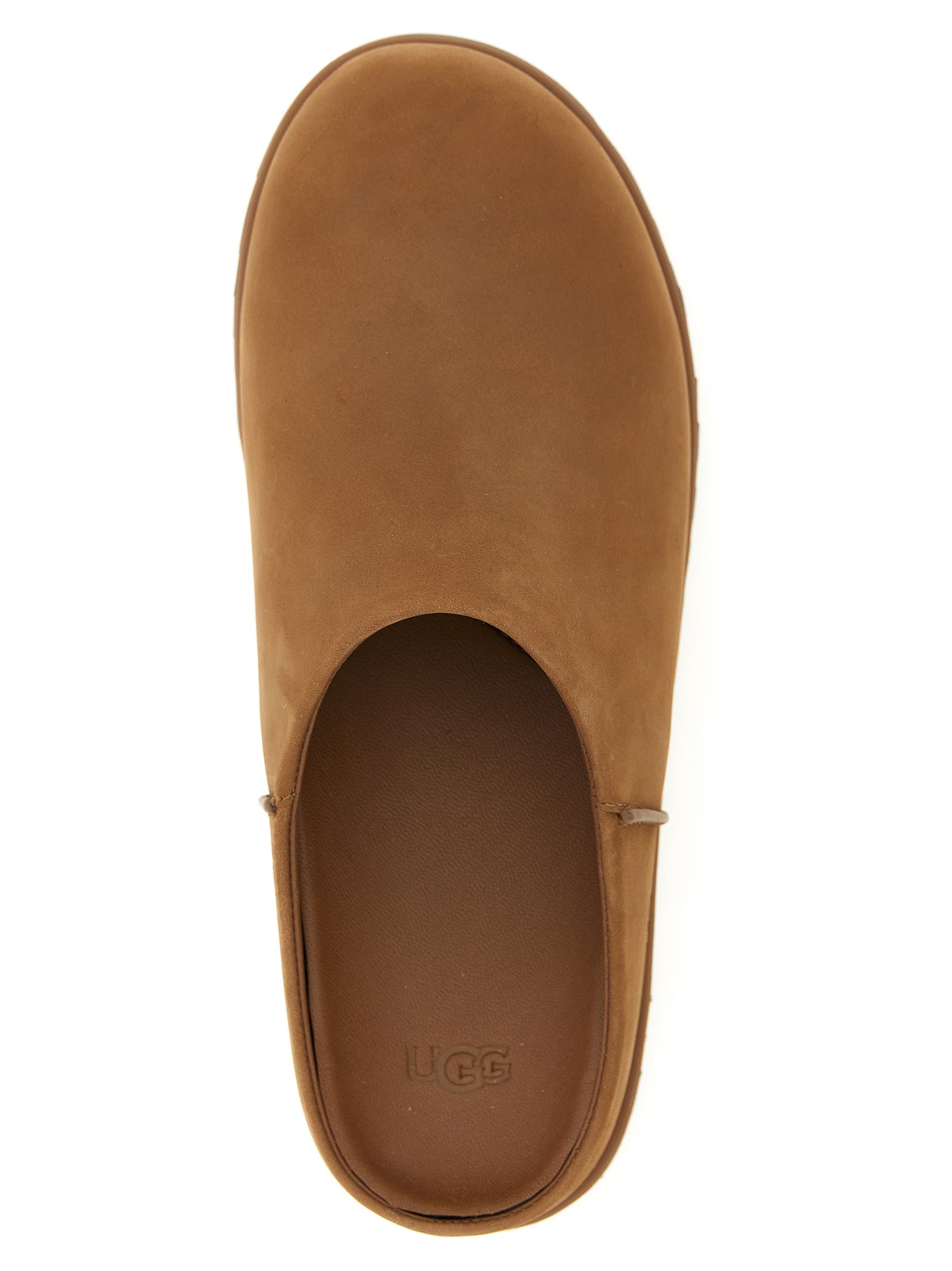 Detail van het bruine nubuckleer en de zoolrand van de UGG Otzo Clog