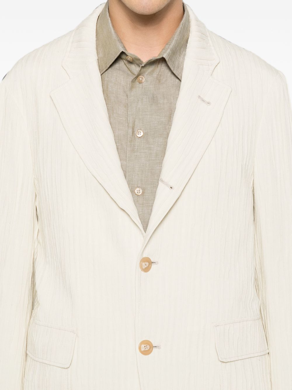 Revers en gekreukte viscose structuur van beige blazer