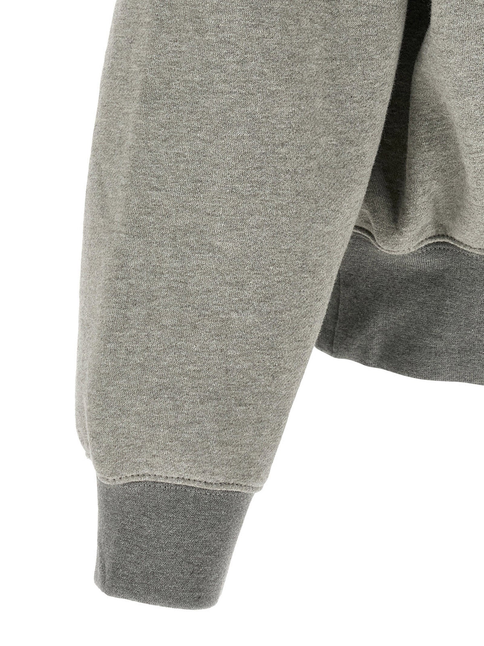 Detail van de kangoeroezak en geribde manchet in Dark Concrete Heather