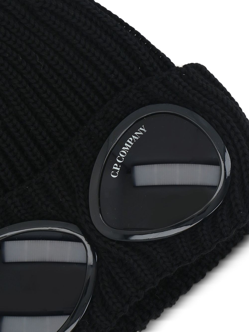 C.P. Company Goggle muts in zwarte wol, detail Goggles-bril op de omslag