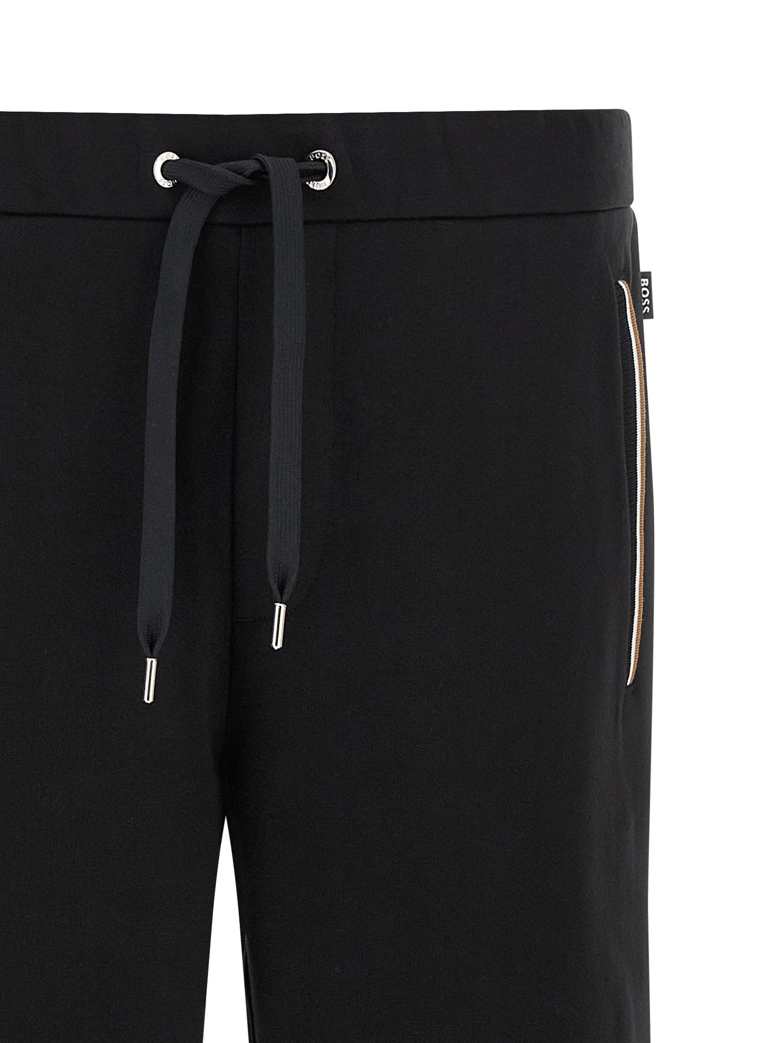 Detail van de elastische taille met trekkoord en metalen oogjes