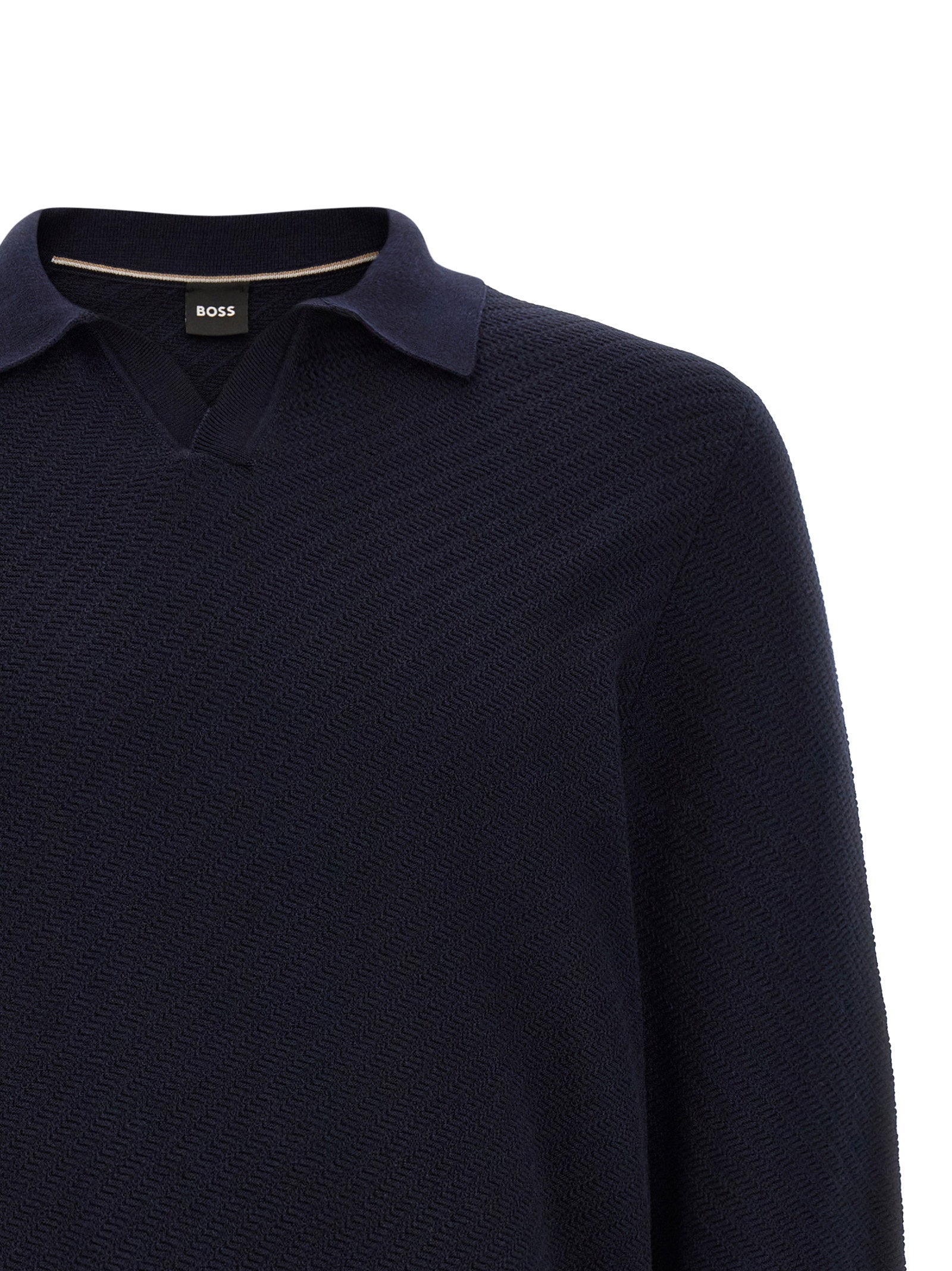 Hugo Boss H-lomarino polo in marineblauw, detail van het logolabel in de zijnaad