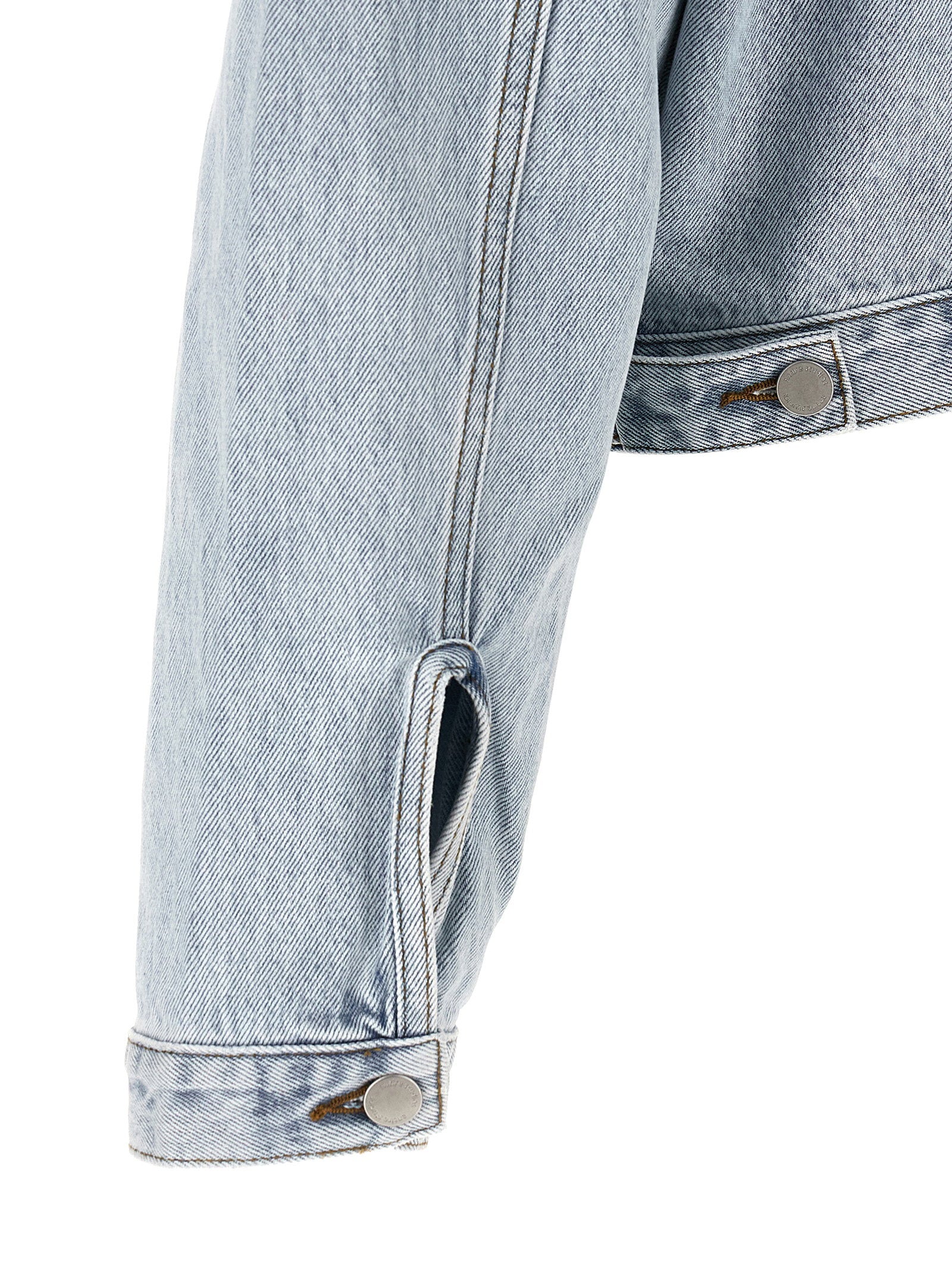 Entire Studios Shrunken Denim jack lichtblauw, detail van de verstelbare bandjes aan de zoom