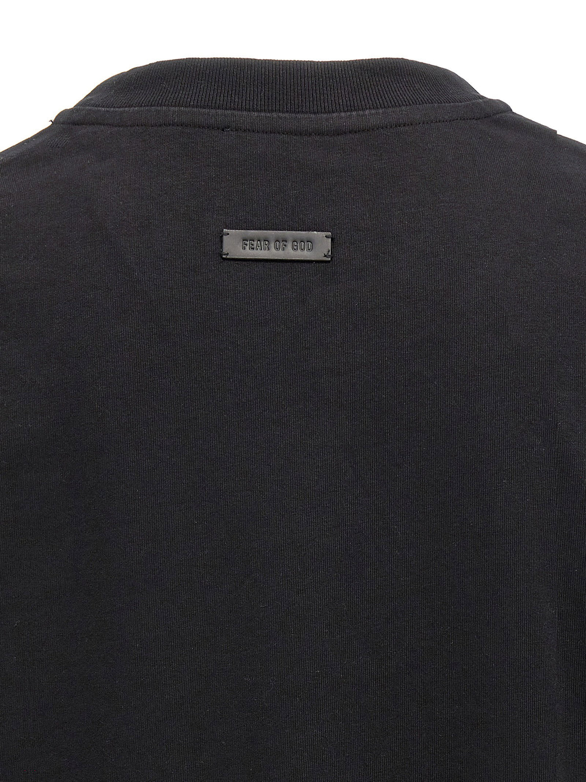 Close-up van de zwarte jerseystof en de manchet
