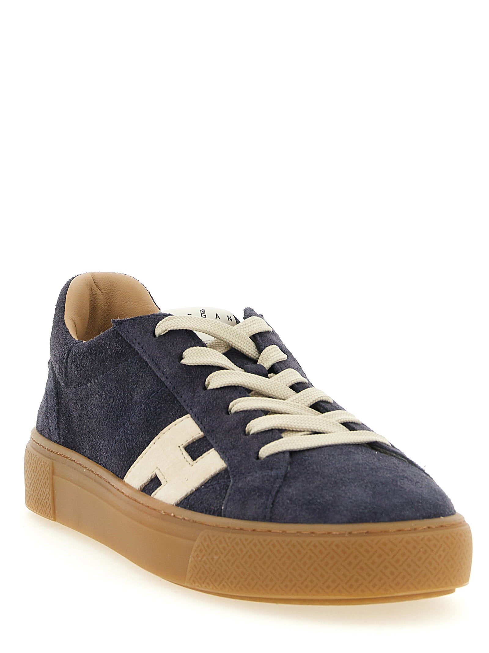 Hogan Crosswind sneaker in donkerblauw suede, close-up van de honingkleurige zool