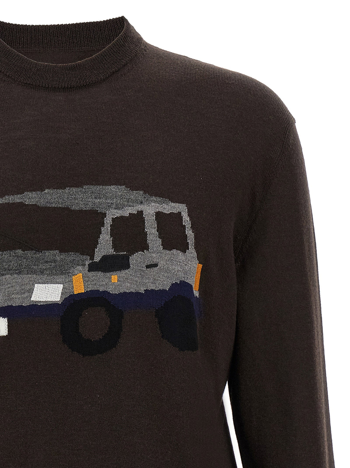 Detail van het ingebreide terreinwagenmotief in grijs, blauw en oranje