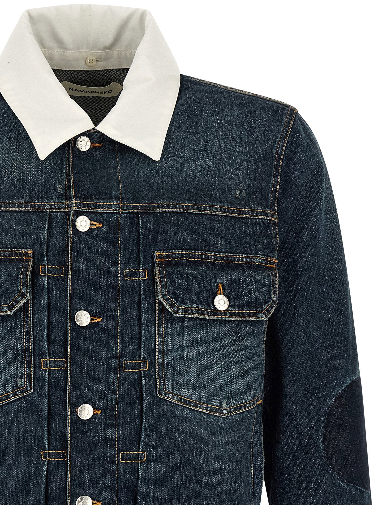 Namacheko Laguna jacket, close-up van de metalen knoopsluiting