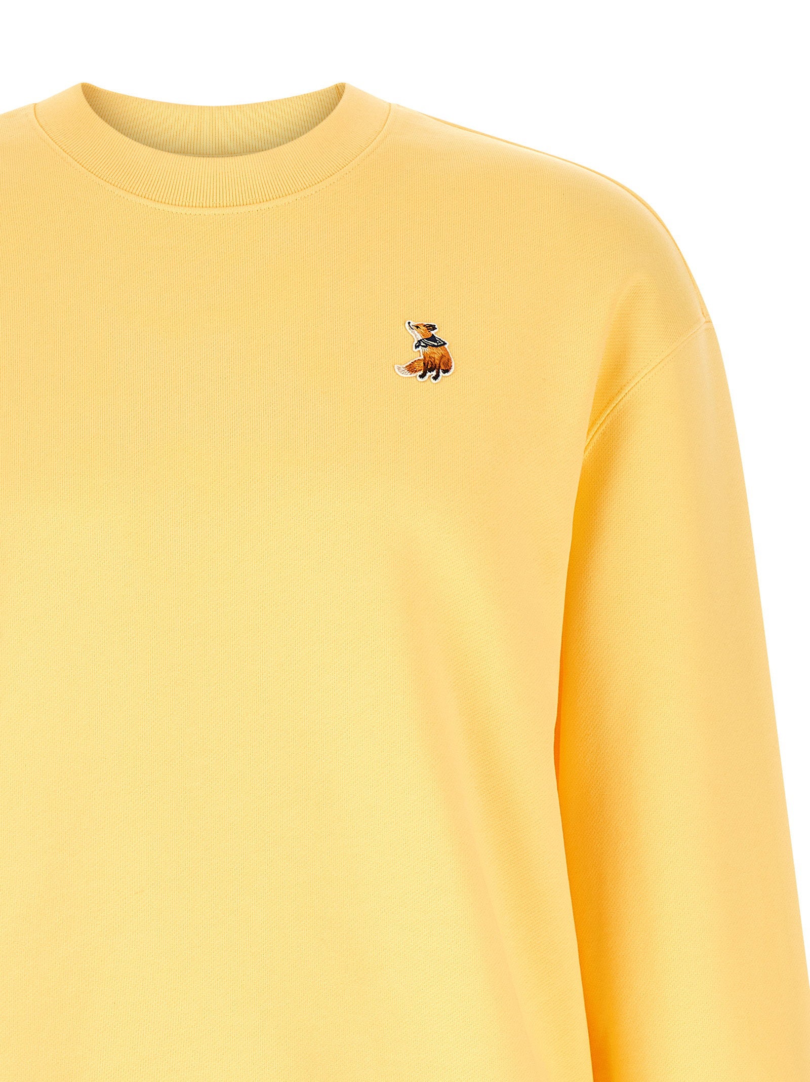 Maison Kitsuné geel sweatshirt, detail van de geribde boord