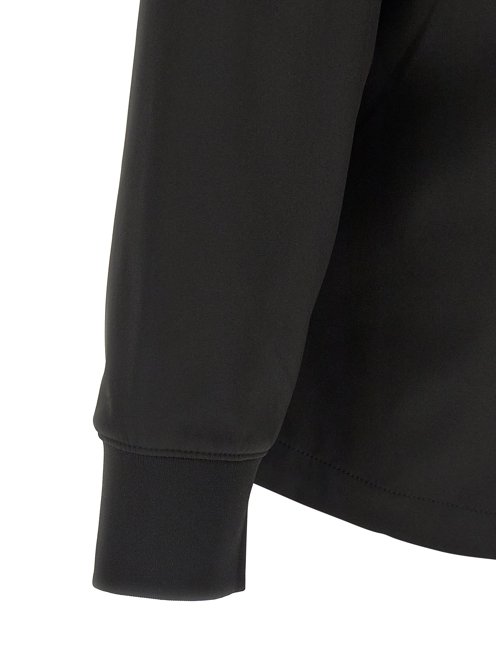 Detail van de elastische manchet in zwarte C.P. Shell-R softshell