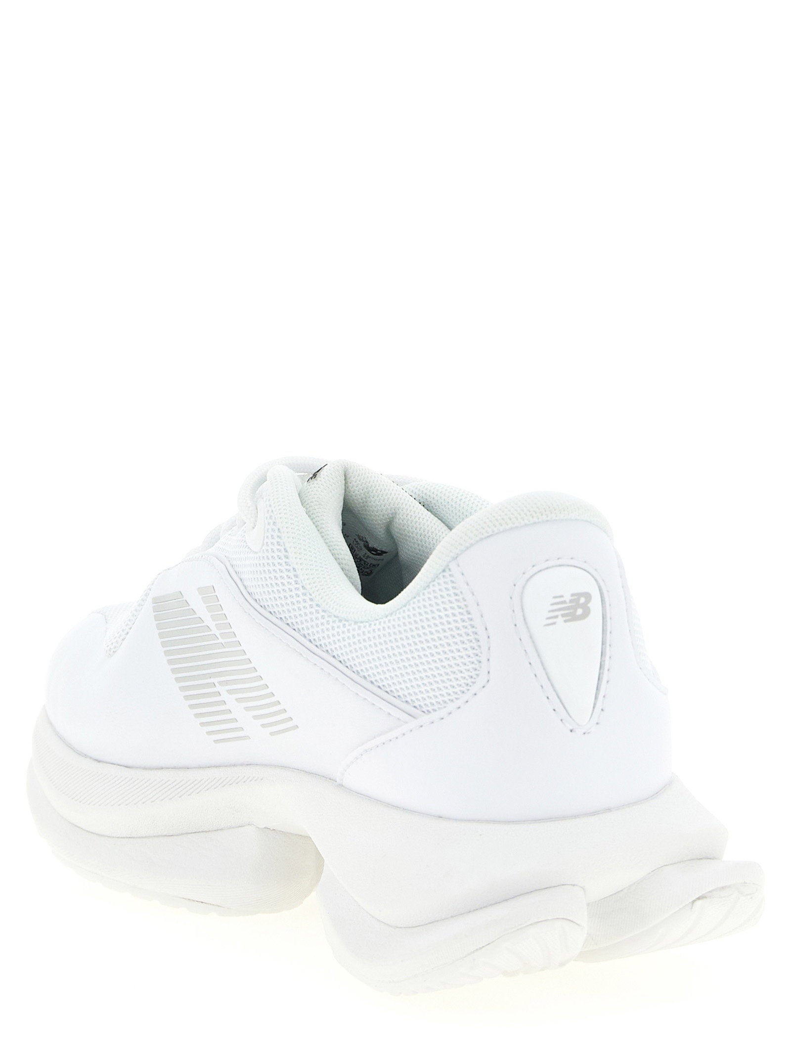 New Balance TF100 sneaker detail van middenzool en voetboog